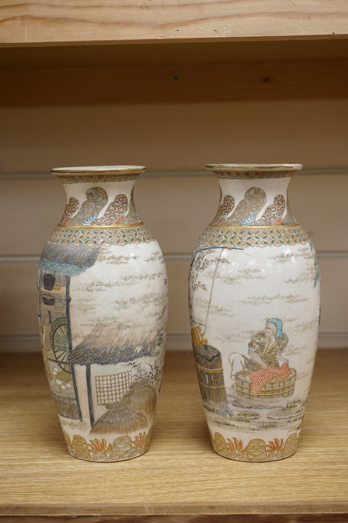 A pair of Japanese Satsuma vases,Meiji period, signed, 23cm